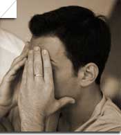 Person experiencing facial discomfort, illustrating symptoms of Ramsay Hunt Syndrome